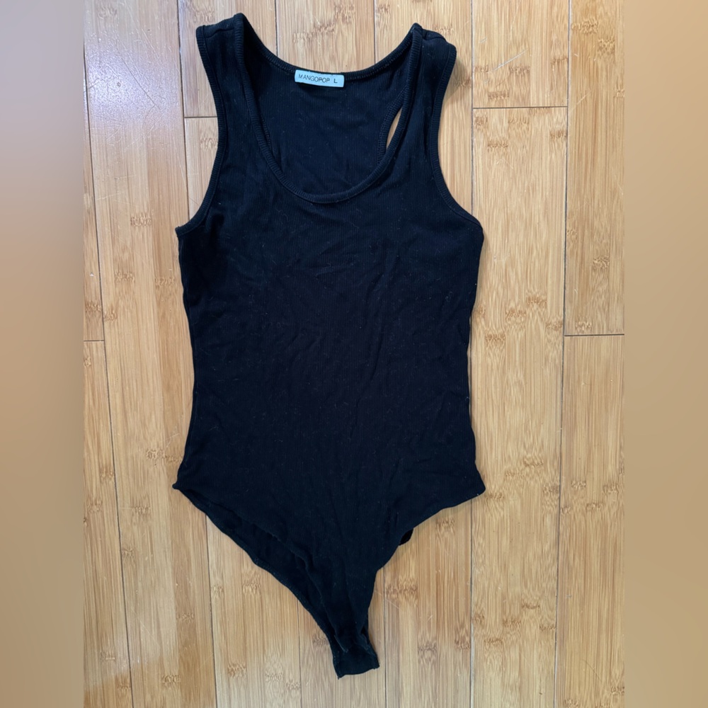 Never worn- racer back black body suit, sleeveless. Snap Buttons